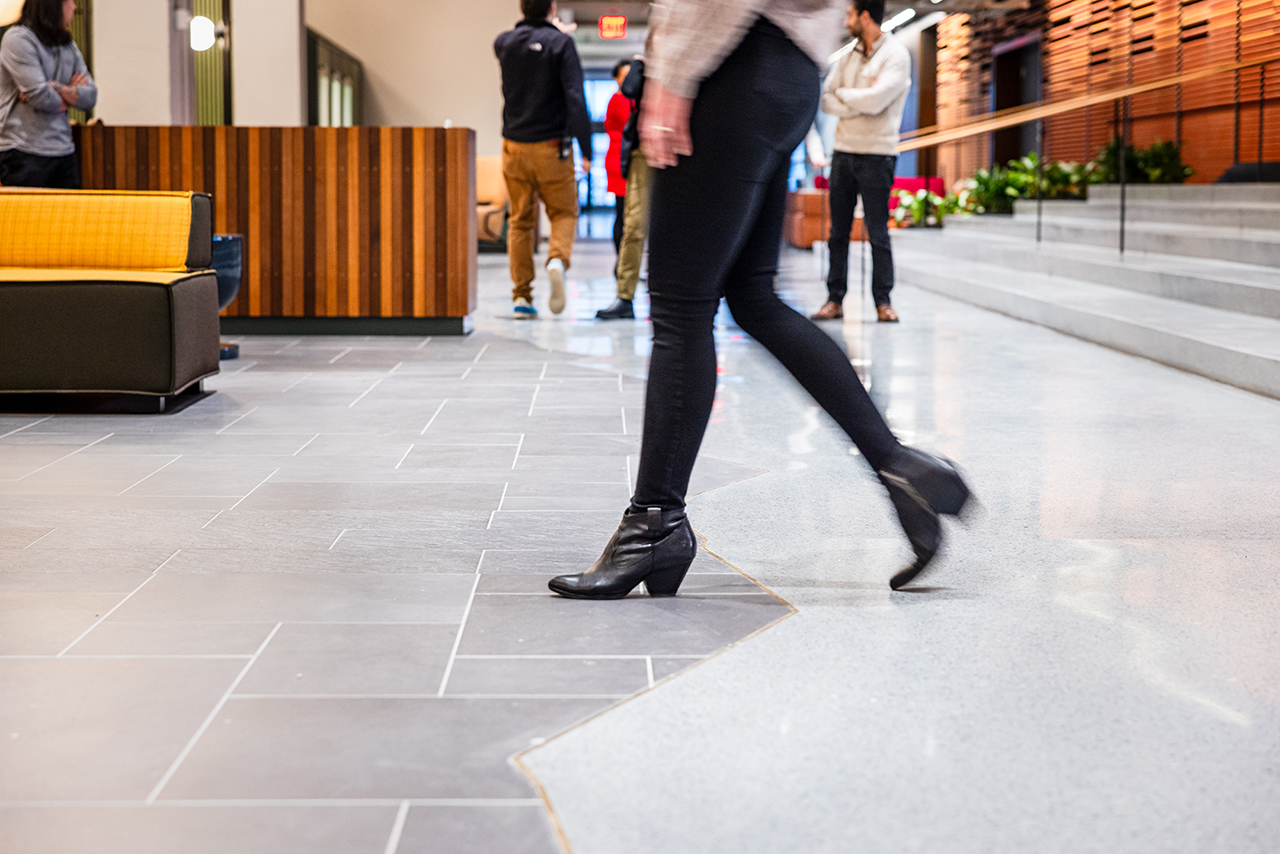 Person stepping across representation of the shoreline